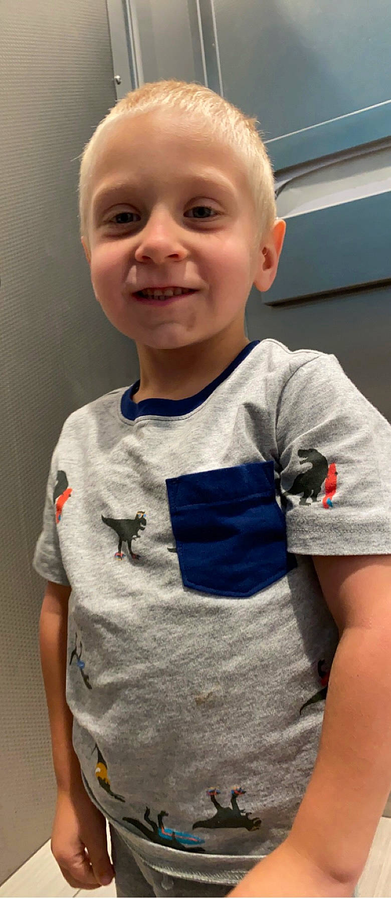 Bentley is registered to the contest to win money with this photo: baby_toddler_clothing, cheek, child, cool, elbow, electric_blue, face, fun, gesture, grey, happy, head, joy, neck, pattern, person, sleeve, smile, standing, t_shirt