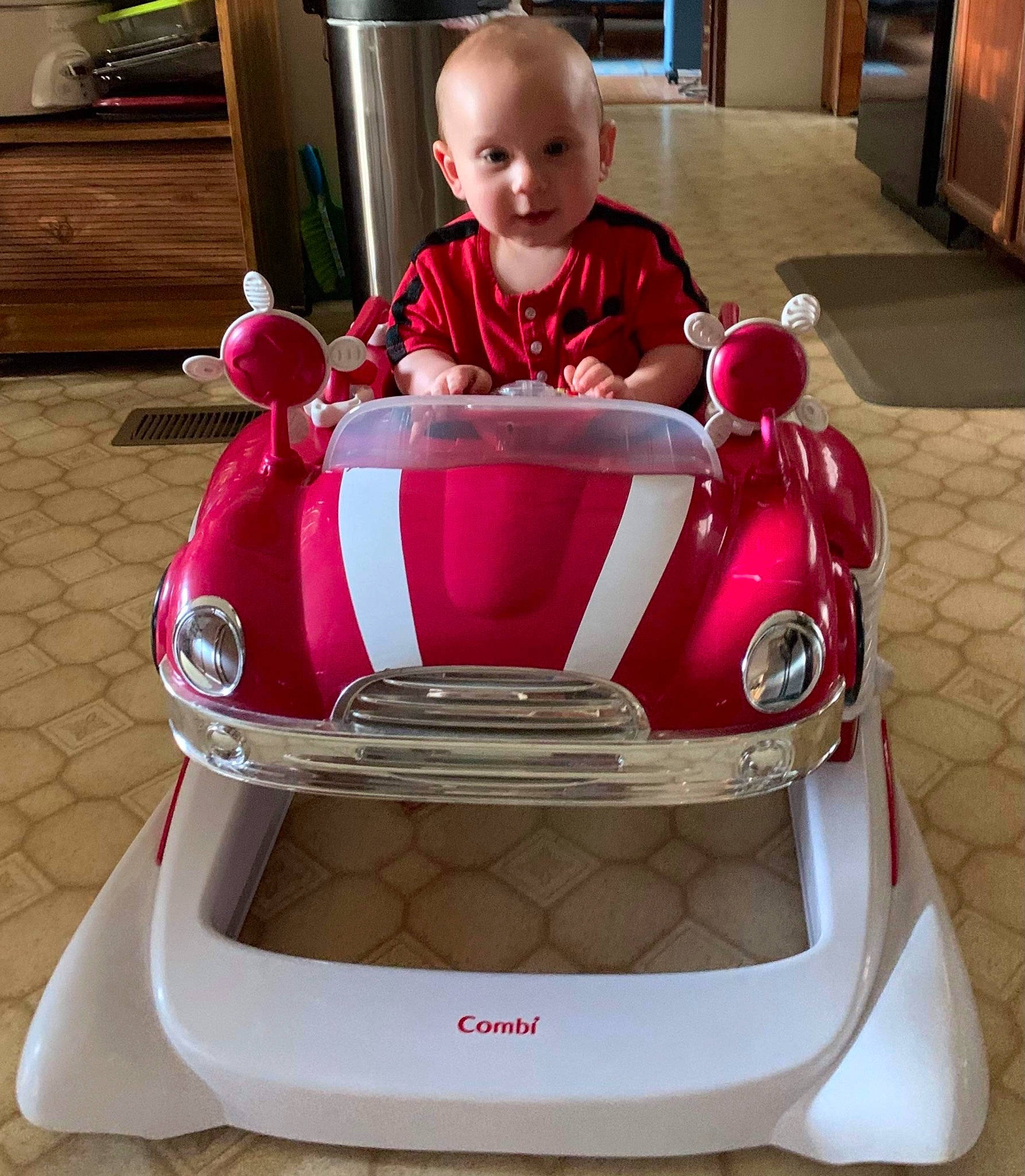 Konnor is registered to the contest to win money with this photo: automotive_design, automotive_exterior, automotive_lighting, automotive_tire, bumper, cabinetry, car, drawer, grille, headlamp, hood, leg, motor_vehicle, person, personal_luxury_car, riding_toy, tire, toddler, vehicle, vehicle_door