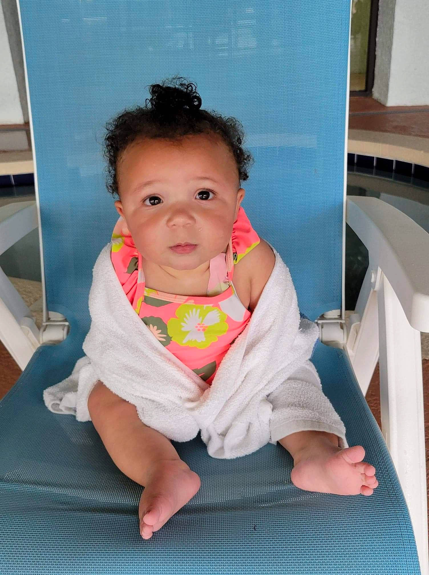 Alaya is registered to the contest to win money with this photo: baby, baby_products, baby_toddler_clothing, bib, cheek, child, chin, comfort, dress, eye, floor, flooring, fun, happy, leisure, person, pink, recreation, sitting, skin