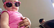 Paisley Rae is registered to the contest to win money with this photo: abdomen, arm, child, cool, eyewear, finger, fun, glasses, hand, human_leg, leg, mouth, pink, selfie, sitting, skin, sunglasses, thigh, vacation, vision_care