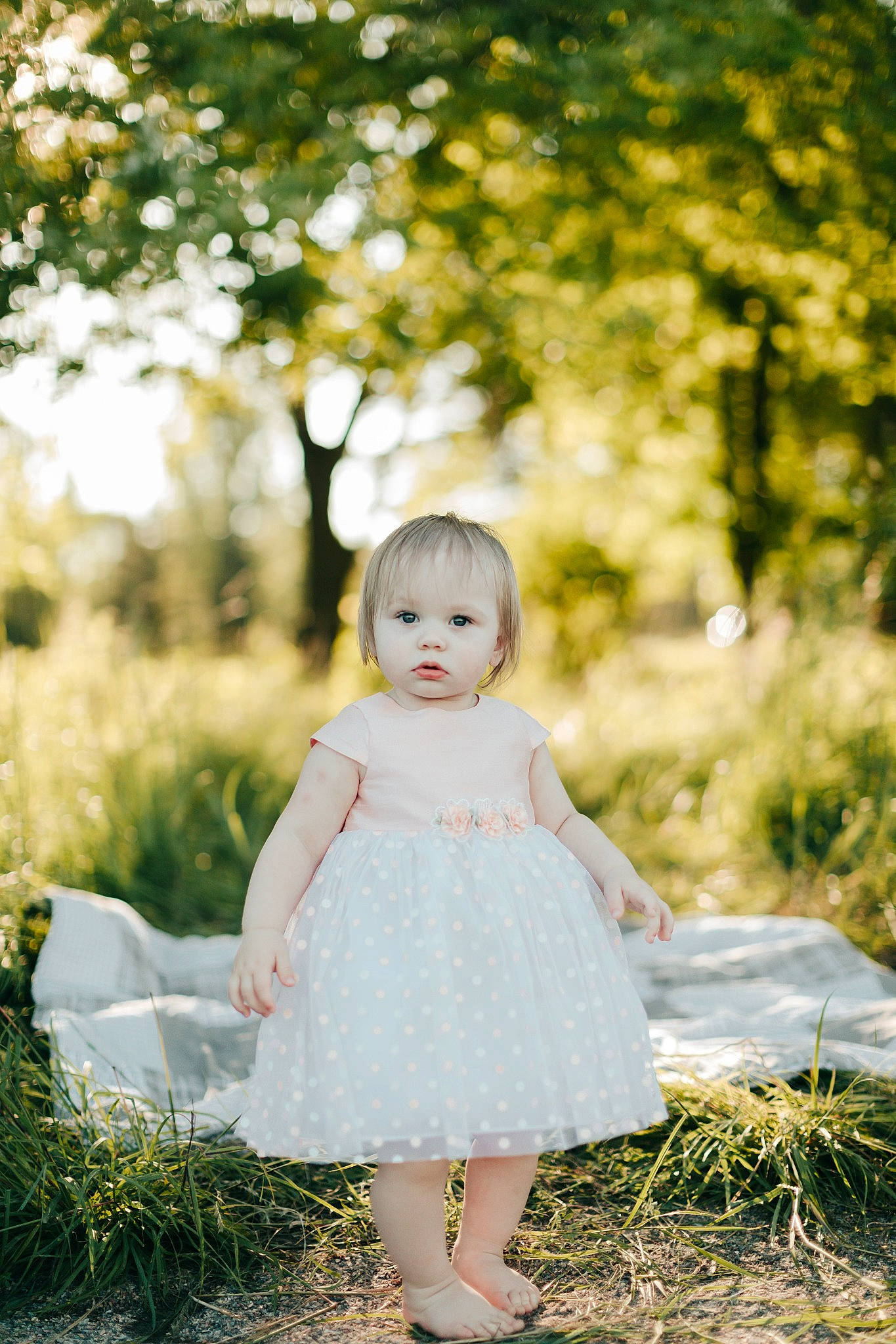 Paris is registered to the contest to win money with this photo: baby, beauty, child, dress, grass, long_hair, people_in_nature, person, photograph, photography, pink, plant, portrait, portrait_photography, skin, spring, summer, sunlight, toddler, tree