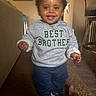 Noah is registered to the contest to win money with this photo: blue_pants, carpet, casual, child, clothing, cute, family, foot, furniture, happy, home, indoor, person, portrait, shoes, smiling, sweatshirt, toddler, walking, young_child