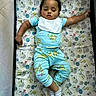 animal_print, baby, bedtime, blue, child, clothing, crib, cute, indoors, infant, mattress, nap, pajamas, peaceful, playpen, resting, sleeping, socks, toddler, young_child