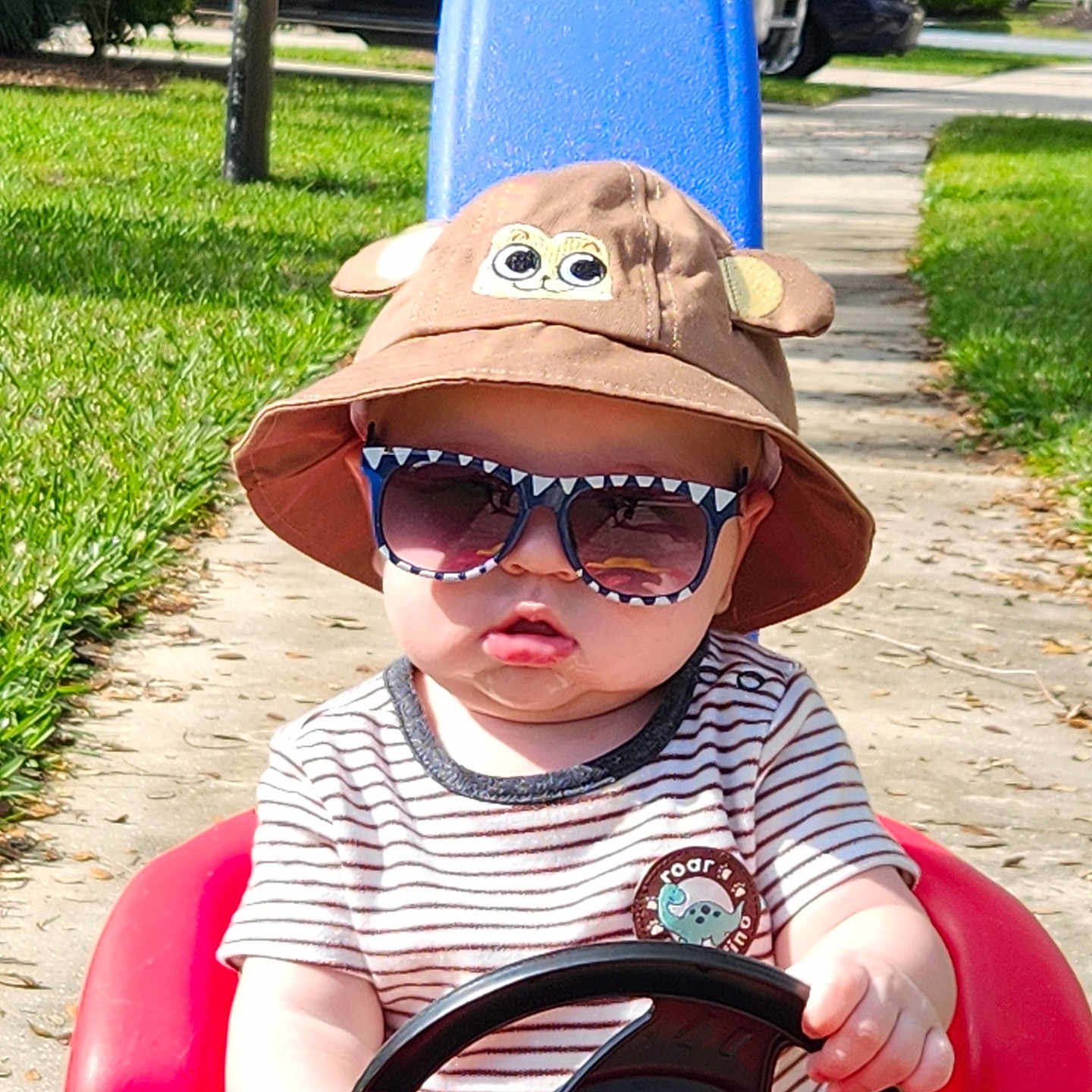 Barrett is registered to the contest to win money with this photo: accessories, city, clothing, face, glasses, grass, hat, head, nature, outdoors, park, person, photography, plant, portrait, road, street, summer, sunglasses, urban
