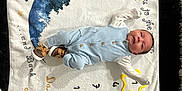 Greyson joined the competition — help win amazing prizes! baby, infant, onesie, milestone_blanket, star, moon, blue_clothing, lying_down, cute, child, smiling, indoor, soft_blanket, numbers, milestone_marker, wooden_floor, baby_shoes, white_blanket, decorative_text, cozy
