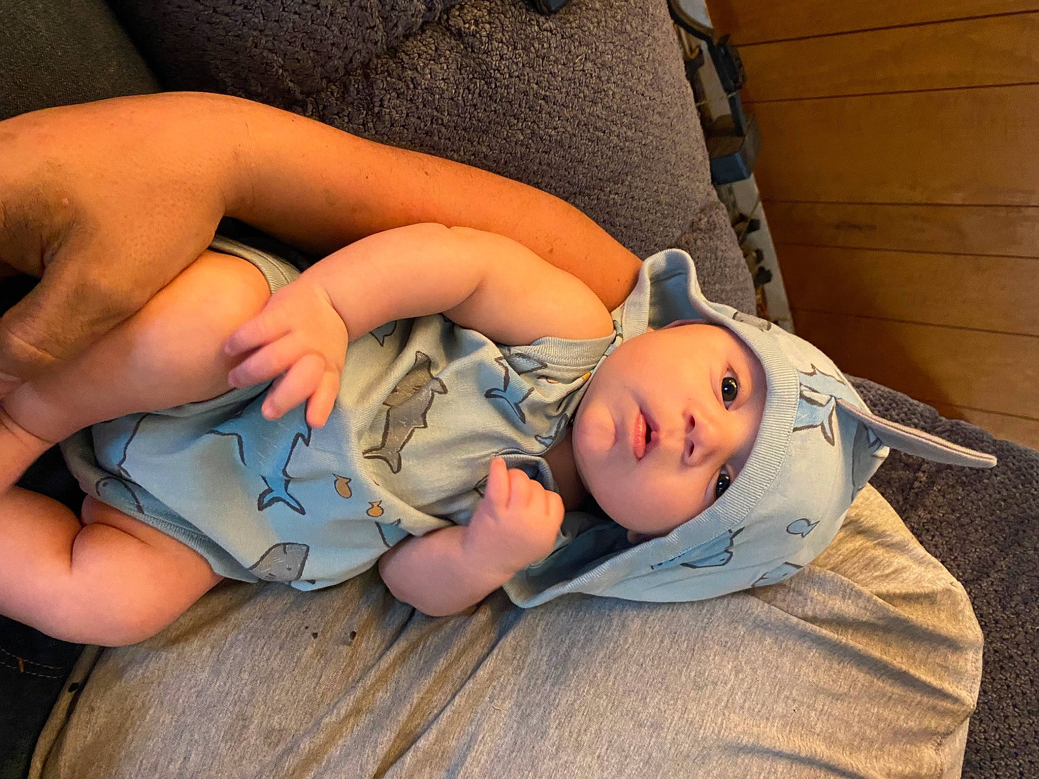 Clayton John is registered to the contest to win money with this photo: arm, baby, baby_products, baby_toddler_clothing, cheek, child, comfort, eye, finger, hand, head, headwear, human_body, human_leg, leg, mouth, person, sitting, skin, thigh