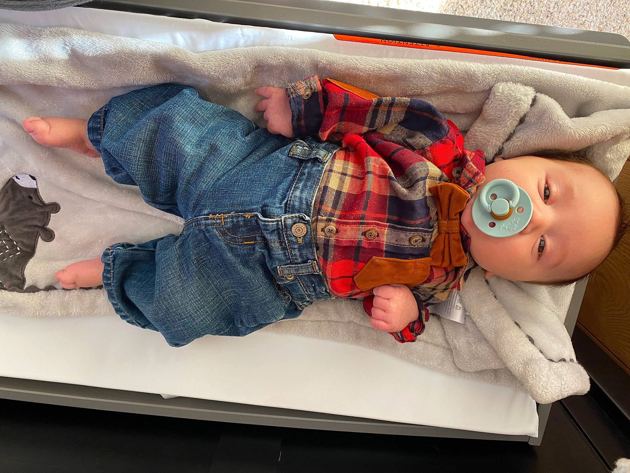 Clayton John is registered to the contest to win money with this photo: baby, baby_products, baby_toddler_clothing, bed, carmine, child, comfort, denim, doll, linens, nap, pattern, person, plaid, room, sitting, tartan, toddler, toy, window