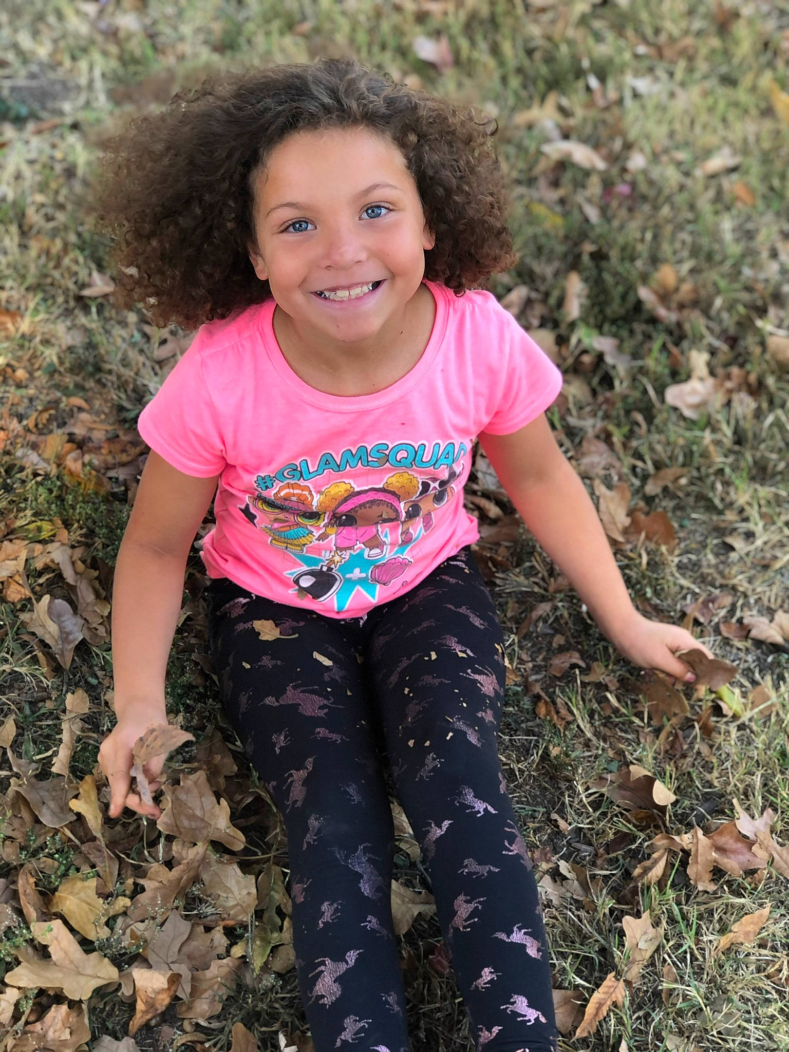 Laniyah is registered to the contest to win money with this photo: adaptation, beauty, botany, child, face, fun, grass, happy, head, joy, leaf, magenta, pattern, people_in_nature, person, sleeve, smile, soil, spring, t_shirt