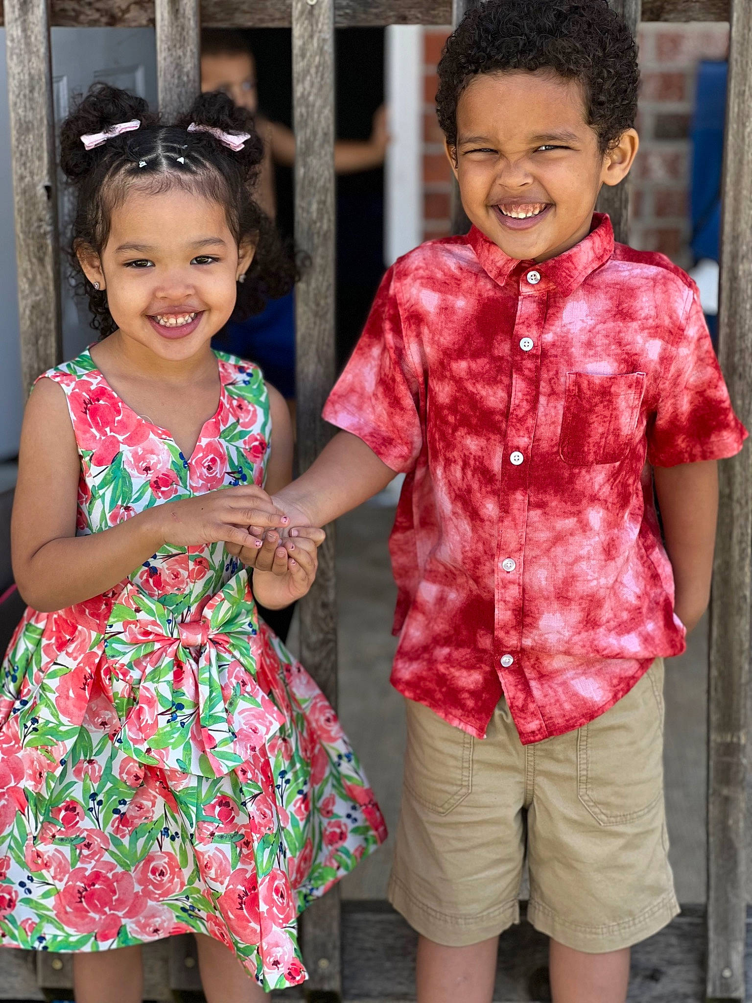 Nadia is registered to the contest to win money with this photo: baby_toddler_clothing, eye, face, facial_expression, fashion, gesture, hair, hairstyle, happy, human, interaction, joy, one_piece_garment, person, pink, shoulder, skin, sleeve, smile, standing