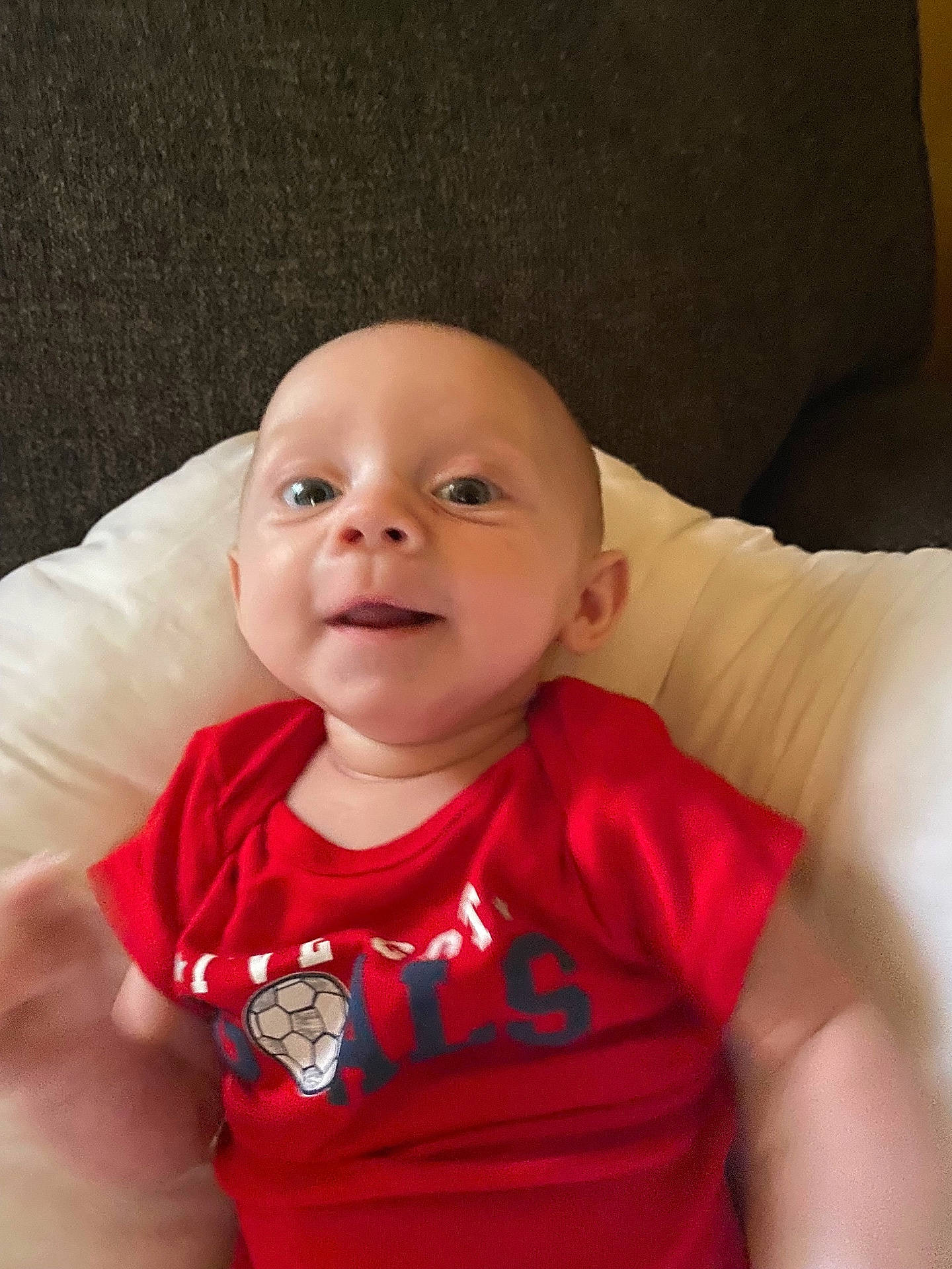 Elijah joined the competition — help win amazing prizes! accessories, baby, babylaughing, clothing, couch, cushion, face, furniture, happy, head, homedecor, jewelry, necklace, newborn, person, photography, portrait, shirt, smile, t_shirt