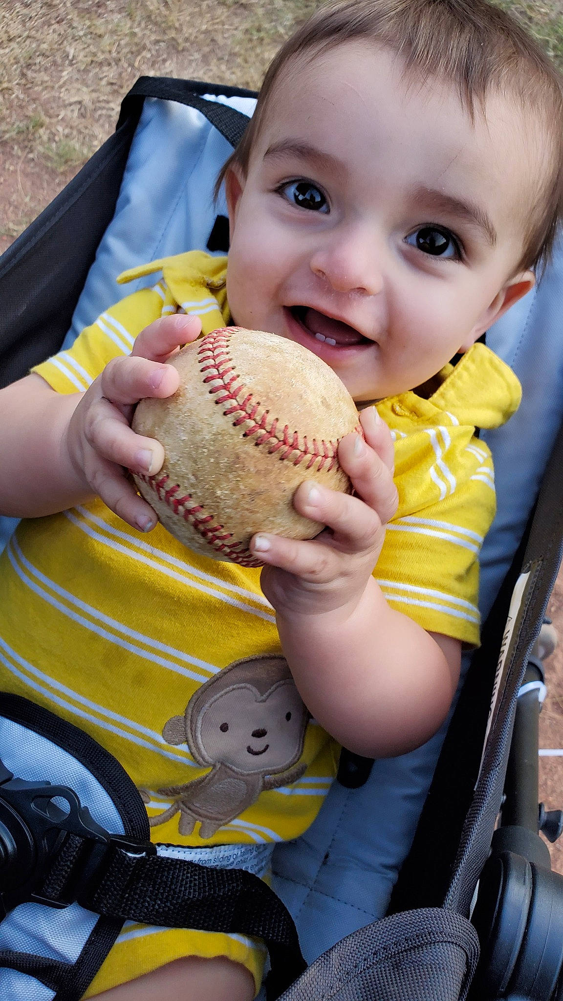 Rustin is registered to the contest to win money with this photo: baby, baseball_glove, child, fashion_accessory, glove, hat, person, personal_protective_equipment, play, smile, toddler