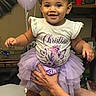 toddler, child, smiling, portrait, tiara, dress, tutu, lavender, butterflies, birthday, balloons, indoor, celebration, sitting, being_held, adult_hands, family, happy, furniture, home