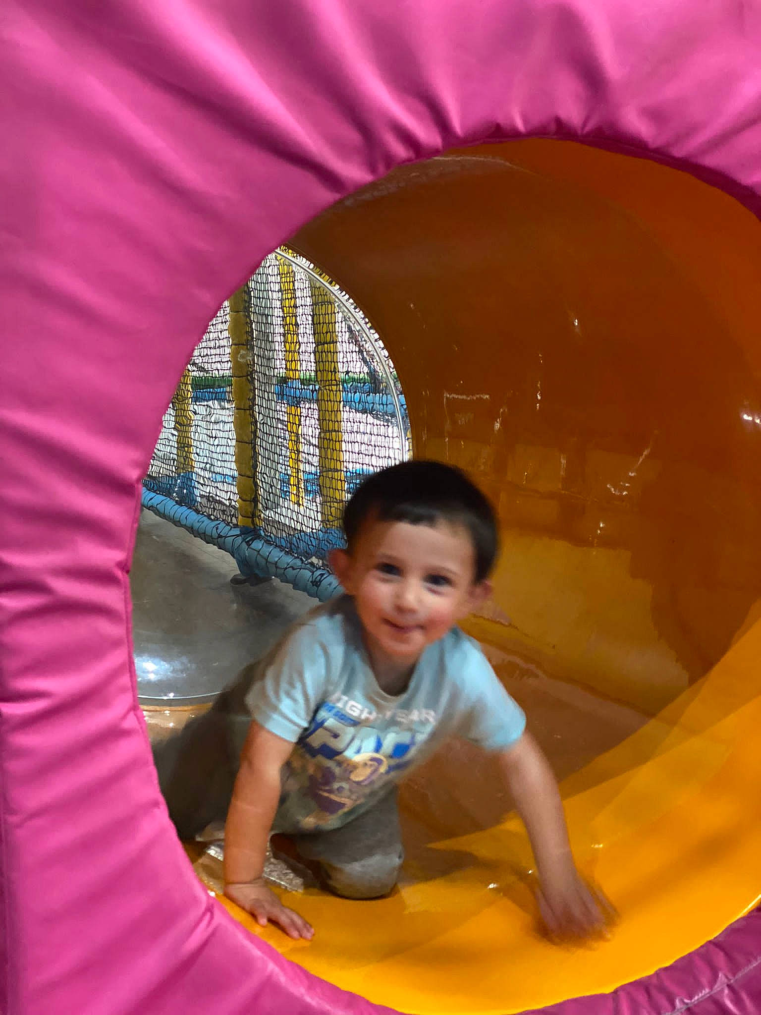 Zayan is registered to the contest to win money with this photo: child, chute, eye, fun, happy, joy, leisure, light, organ, outdoor_play_equipment, person, photograph, pink, playground, recreation, red, smile, snapshot, tints_and_shades, toddler