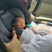 Blakelynn Elizabeth joined the competition — help win amazing prizes! newborn, baby, car_seat, blanket, sleeping, hand, adult_hand, car_interior, sunlight, graco, infant, child, safety_harness, pink, polka_dots, seatbelt, peaceful, cute, portrait, resting