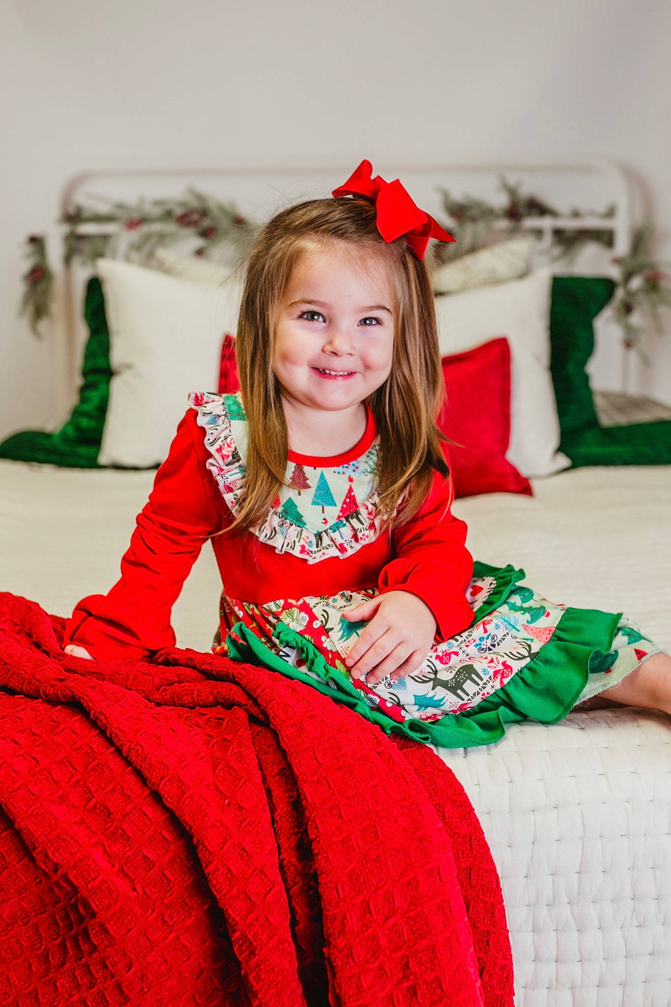 Kreegan is registered to the contest to win money with this photo: baby_toddler_clothing, child_model, christmas, costume, costume_accessory, couch, embellishment, facial_expression, hair_accessory, happy, headband, joy, person, red, sleeve, sock, textile, tradition, velvet