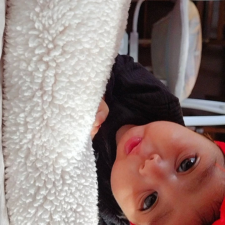 Delilah joined the competition — help win amazing prizes! baby, baby_toddler_clothing, cheek, child, comfort, eyebrow, eyelash, fur, gesture, happy, headwear, linens, lip, neck, nose, person, room, skin, smile, textile