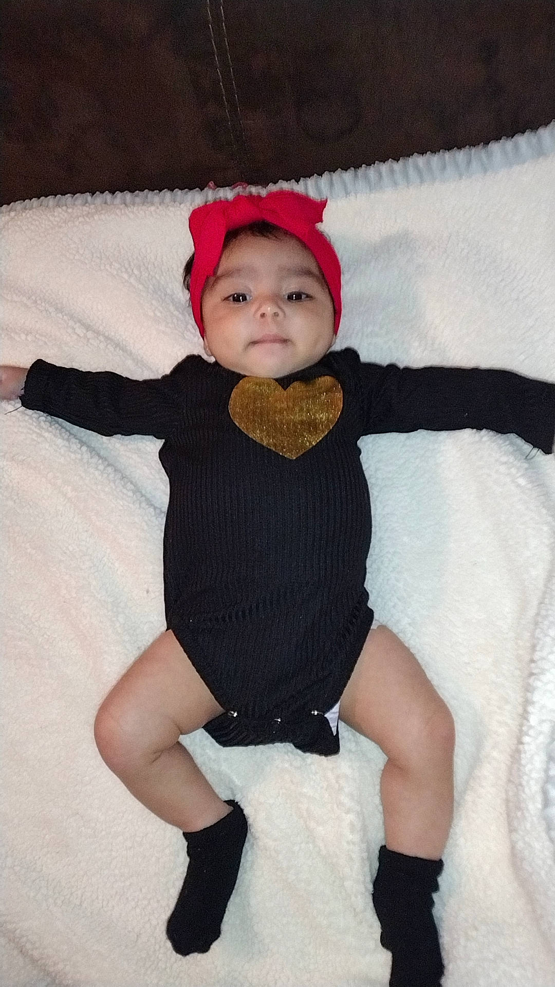 Delilah joined the competition — help win amazing prizes! baby, baby_toddler_clothing, comfort, embellishment, eye, face, fashion_accessory, flash_photography, head, headgear, headwear, human_leg, knee, leg, pattern, person, sitting, sleeve, sock, textile