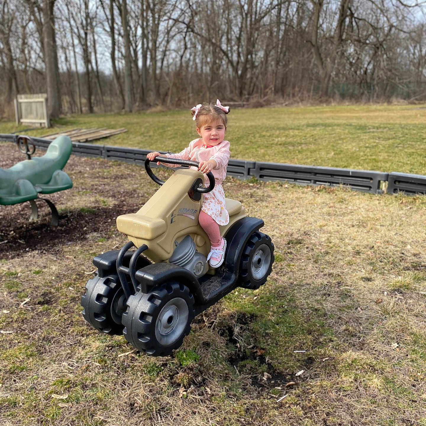 Liliana is registered to the contest to win money with this photo: child, clothing, face, female, footwear, girl, grass, grove, head, nature, outdoors, park, person, photography, plant, portrait, shoe, sitting, tree, vegetation