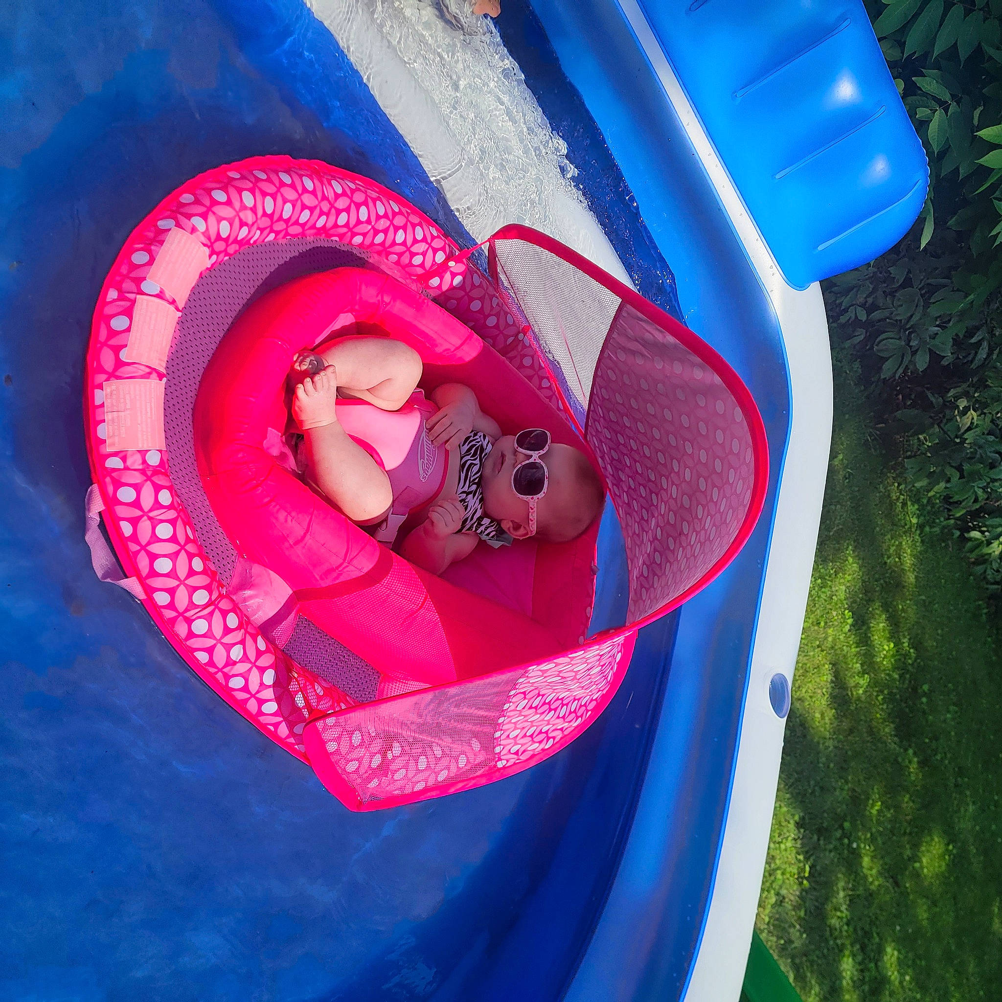 Gianna joined the competition — help win amazing prizes! baby_float, baby_products, baby_toddler_clothing, blue, boats_and_boating_equipment_and_supplies, carmine, electric_blue, fashion_accessory, fun, grass, happy, inflatable, leisure, lifejacket, magenta, person, personal_protective_equipment, recreation, sandal, toddler