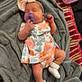 Nakiyah joined the competition — help win amazing prizes! baby, bow, child, closeup, cute, floral_dress, gray, headband, indoor, infant, newborn, pacifier, peaceful, person, pink, resting, sleeping, sock, soft_texture, towel