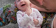 Amayah is registered to the contest to win money with this photo: adult, baby, carpet, child, comic_pattern, cuddle, cute, face, floor, hand, happy, head, indoor, interaction, joy, onesie, pajamas, person, playful, smile