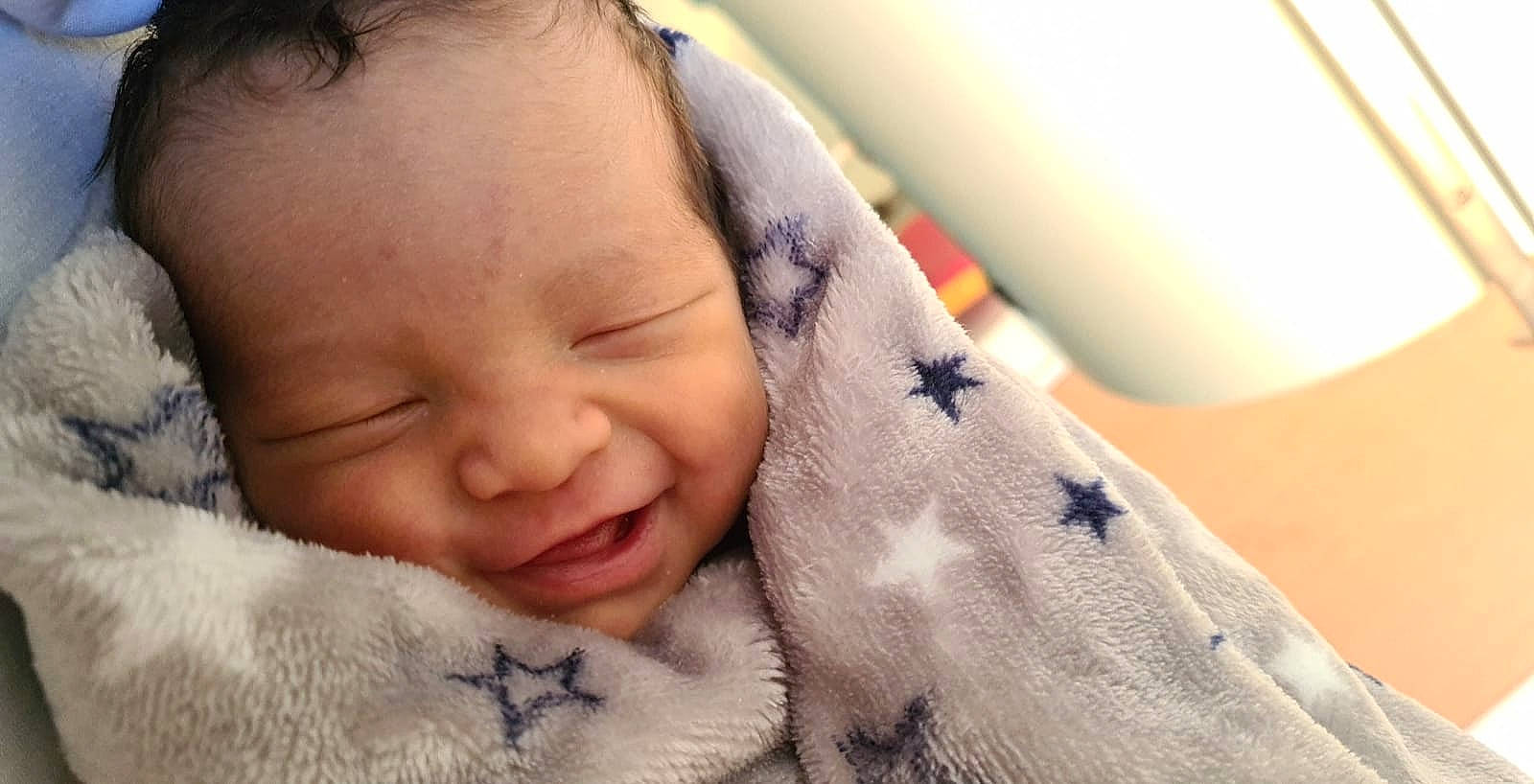 Theyva participe au concours pour gagner de l'argent avec cette photo : baby, bedtime, cheek, child, comfort, ear, eye, eyebrow, eyelash, face, happy, head, linens, lip, mouth, nose, person, skin, smile, thumb