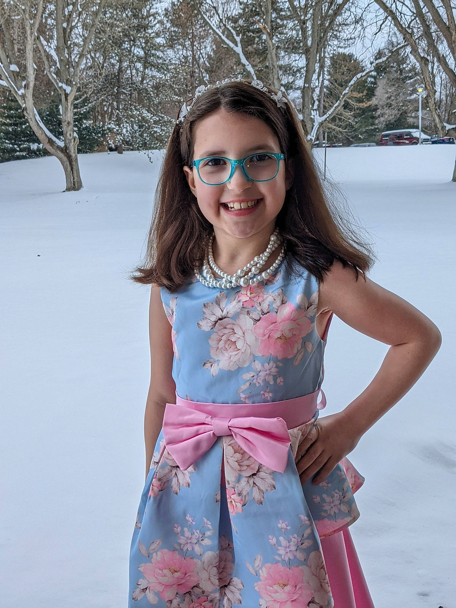 Sadie is registered to the contest to win money with this photo: day_dress, dress, eyewear, face, fashion, fun, glasses, goggles, hair, happy, joy, person, pink, shoulder, skin, sleeve, smile, snow, sunglasses, tree