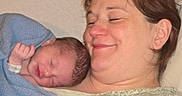 Harmony is registered to the contest to win money with this photo: baby, blanket, bond, closeup, comfort, face, family, head, hospital, human, love, mother, newborn, peaceful, portrait, rest, skin, sleeping, smile, woman
