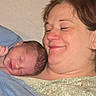 Harmony is registered to the contest to win money with this photo: newborn, baby, mother, woman, smile, sleeping, blanket, hospital, love, bond, skin, face, head, rest, comfort, family, human, portrait, closeup, peaceful