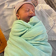 Harmony is registered to the contest to win money with this photo: newborn, baby, sleeping, wrapped, blanket, hat, striped, hospital, bed, towel, infant, cute, peaceful, soft, portrait, child, swaddled, resting, headwear, indoors