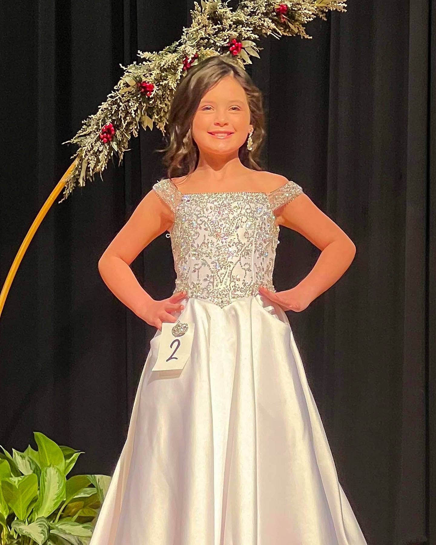 Anniston joined the competition — help win amazing prizes! bridal_clothing, bridal_party_dress, bride, dress, face, fashion, fashion_design, formal_wear, gown, hair, hairstyle, happy, head, headpiece, joy, one_piece_garment, person, plant, red, waist