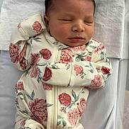 Oni joined the competition — help win amazing prizes! newborn, baby, sleeping, floral_onesie, blanket, infant, cute, peaceful, portrait, clothing, bed, resting, child, soft, indoors, human, small, lying_down, toddler, adorable