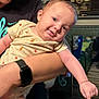 arm, arm_outstretched, baby, casual, child, fruit_print, furniture, happy, head_tilt, holding, indoor, infant, nike_shirt, onesie, person, portrait, radio, skin, smile, watch