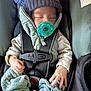 baby, pacifier, car_seat, hat, knitted_hat, sleeping, infant, clothing, safety_harness, cute, hand, footwear, socks, indoor, child, bundle, cozy, resting, newborn, warm