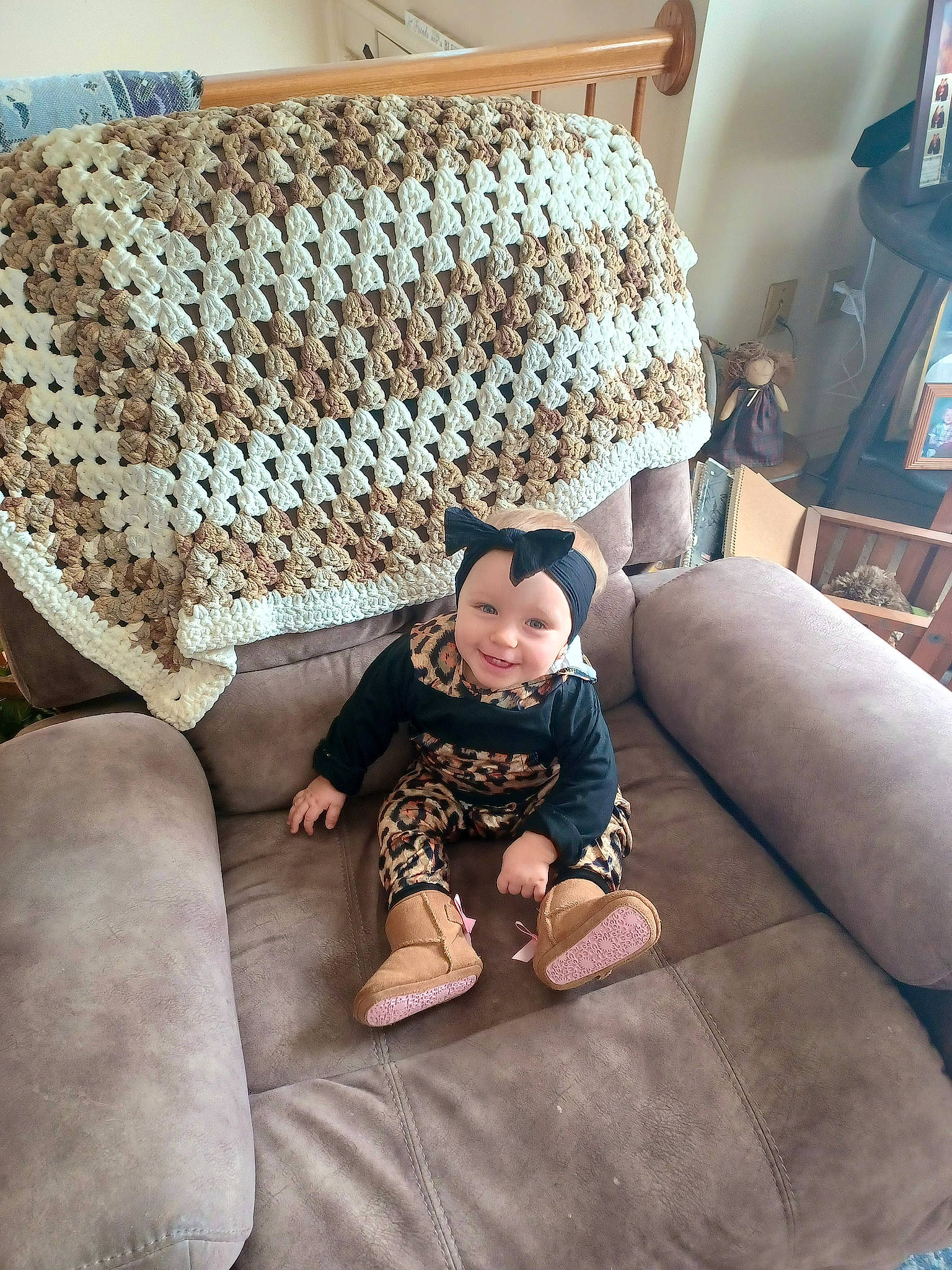 Journee joined the competition — help win amazing prizes! baby, baby_toddler_clothing, chair, child, comfort, couch, floor, flooring, furniture, hardwood, headwear, joy, leisure, linens, living_room, pattern, person, rectangle, room, sitting