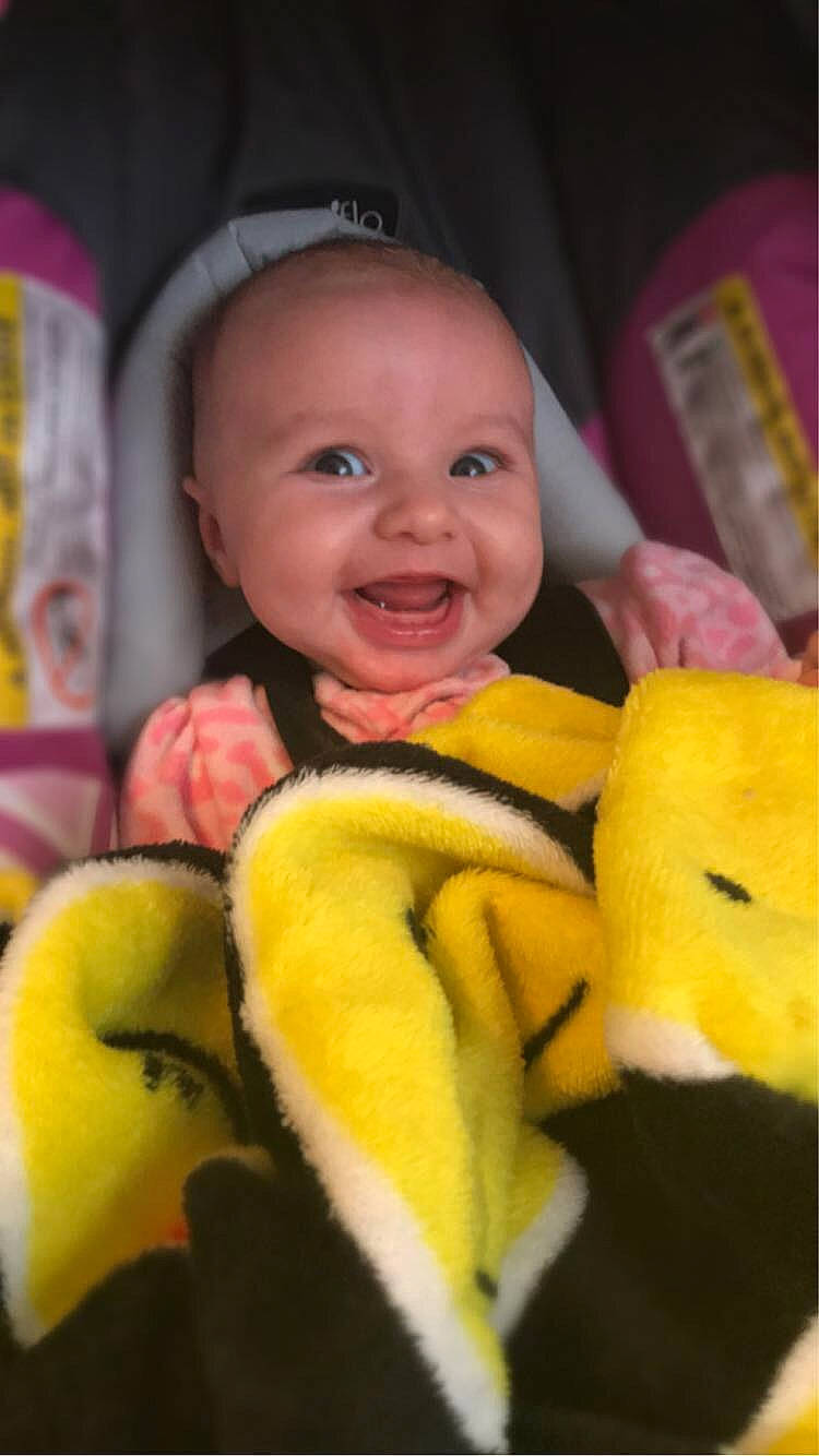 Abriella is registered to the contest to win money with this photo: baby, banana, banana_family, child, fruit, joy, person, plant, plush, skin, smile, stuffed_toy, textile, toddler, toy, yellow