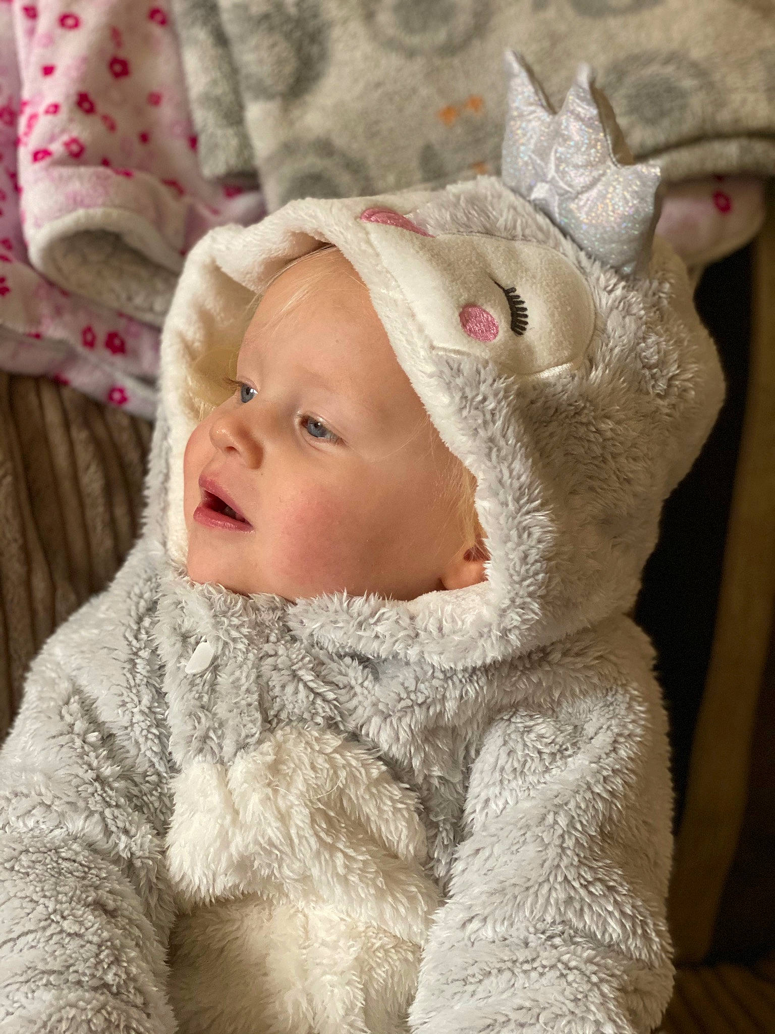Ayva is registered to the contest to win money with this photo: baby, cheek, child, ear, fawn, fur, head, headgear, nose, person, pink, skin, toddler, wool
