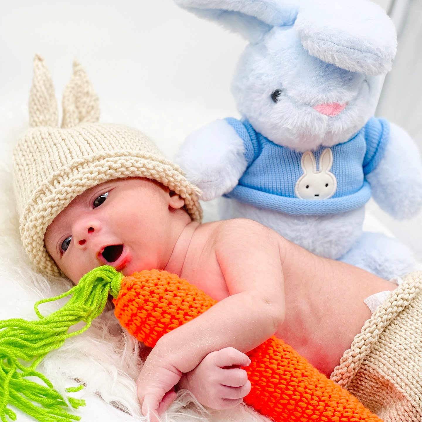 Aaron is registered to the contest to win money with this photo: baby, beanie, blanket, bodypart, bonnet, cap, clothing, face, finger, glove, hand, hat, head, newborn, person, photography, plush, portrait, teddybear, toy
