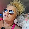 affection, animal, blonde_hair, candid, casual, closeup, companion, dog, face, indoor, interaction, love, necklace, pet, pink_top, portrait, reflection, social_media, sunglasses, woman