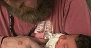 Alayah joined the competition — help win amazing prizes! baby, beard, clothing, comfort, couch, face, family, gentle, holding, home, indoor, intimacy, love, man, newborn, person, portrait, relaxation, seated, tender