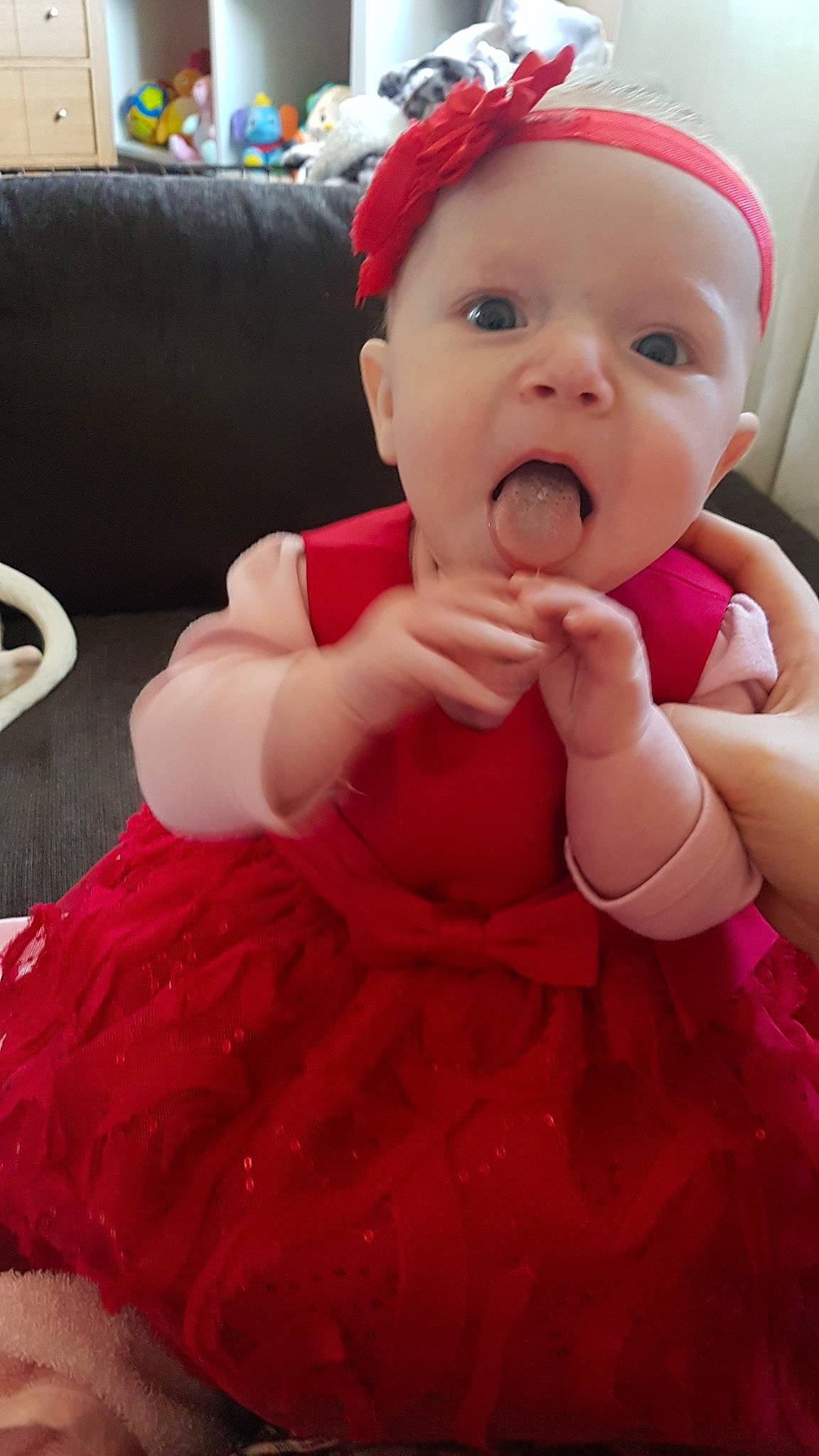 Keiana is registered to the contest to win money with this photo: baby, baby_toddler_clothing, cheek, child, face, facial_expression, finger, hair_accessory, head, lip, mouth, nail, nose, person, pink, red, skin, smile, surprise, toddler