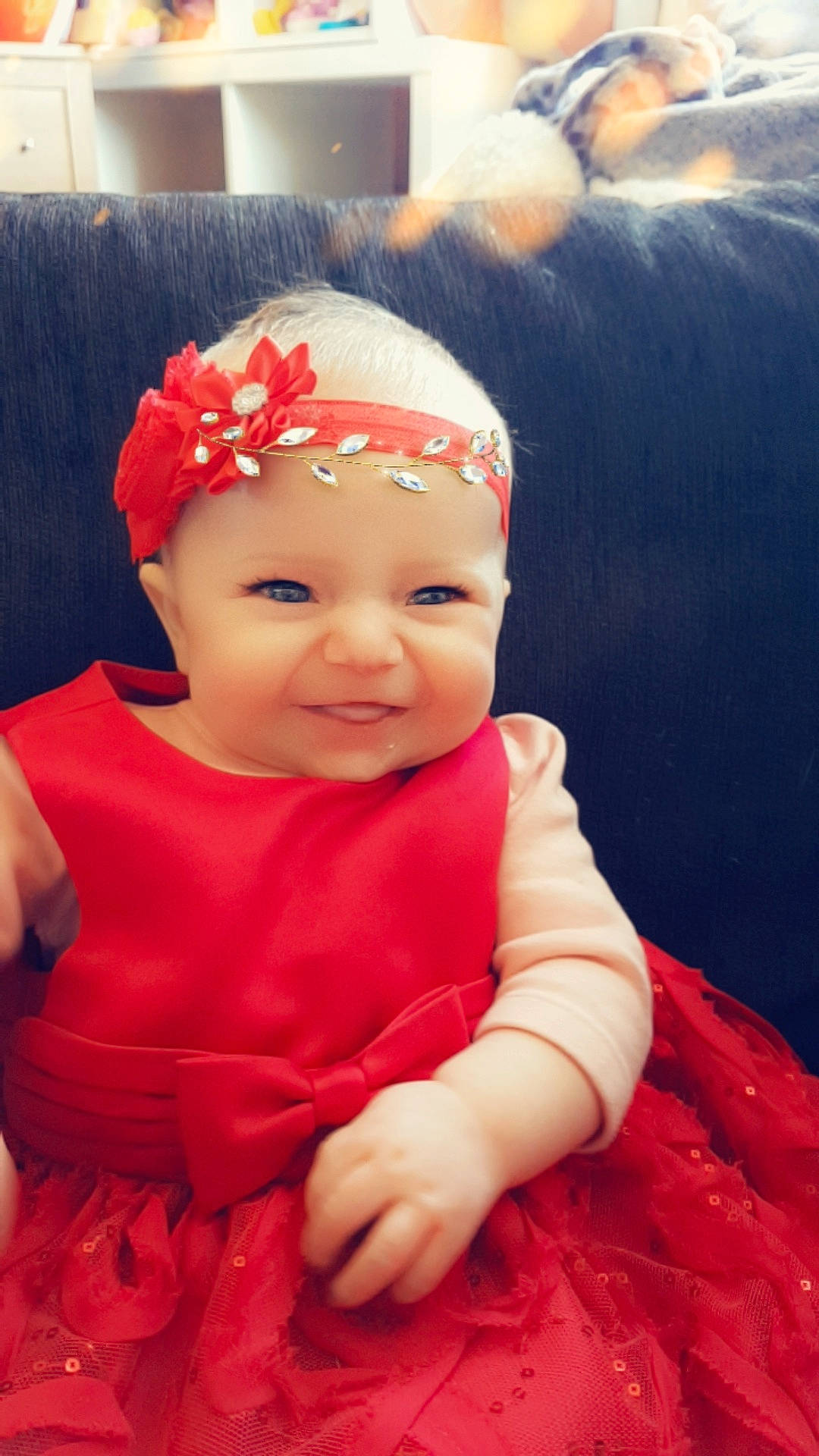 Keiana is registered to the contest to win money with this photo: baby, cheek, child, face, fashion_accessory, forehead, hair_accessory, head, headband, headgear, headpiece, joy, lip, person, pink, red, skin, smile, toddler