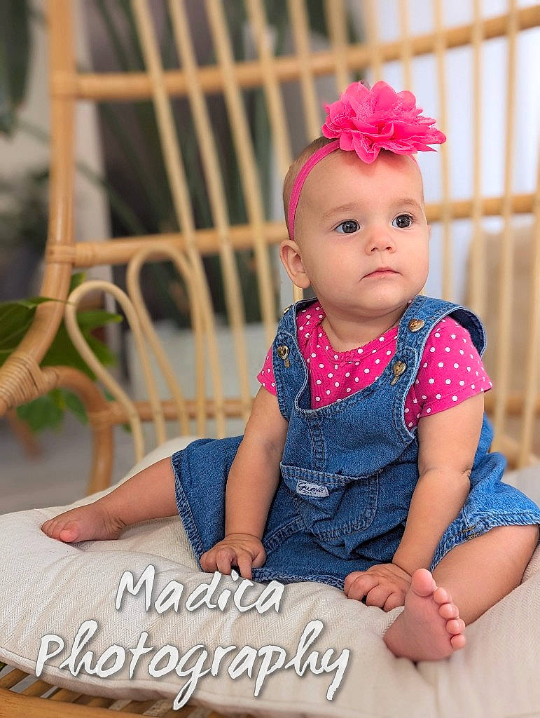 Lyra joined the competition — help win amazing prizes! baby, baby_toddler_clothing, child, dress, electric_blue, face, fashion_accessory, finger, hair_accessory, happy, headband, headpiece, jewellery, magenta, pattern, person, portrait_photography, sitting, skin, sleeve