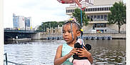 Nature is registered to the contest to win money with this photo: balloon, child, city, clothing, dress, face, fashion, female, formalwear, girl, gown, head, person, photography, portrait, text, water, waterfront, wedding, weddinggown