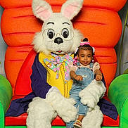 Nature is registered to the contest to win money with this photo: baby, chair, clothing, couch, face, footwear, furniture, glove, hat, head, inflatable, mascot, pants, person, photography, portrait, sandal, shoe, sitting, toy