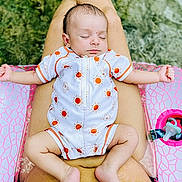 Tuff is registered to the contest to win money with this photo: arm, baby, baby_toddler_clothing, child, dress, finger, foot, grass, happy, human_body, leg, leisure, muscle, people_in_nature, pink, skin, stomach, summer, thigh, toddler