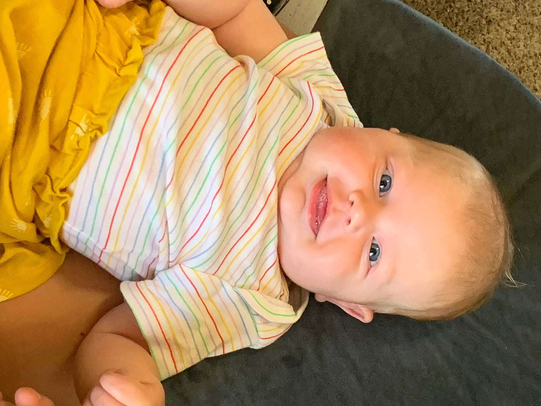 Everly is registered to the contest to win money with this photo: baby_toddler_clothing, cheek, child, comfort, eye, finger, happy, hat, human_body, iris, lip, mouth, neck, nose, person, skin, smile, toddler, tree, wood