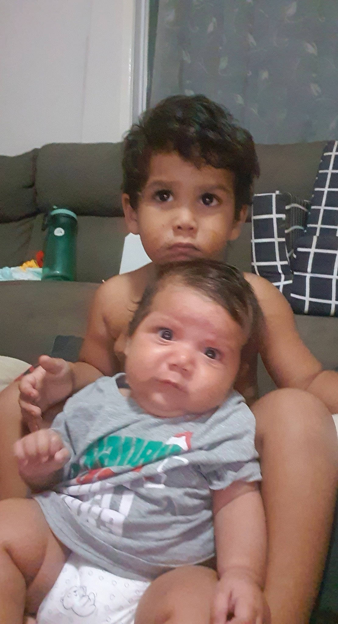 Micheal is registered to the contest to win money with this photo: abdomen, arm, baby, baby_toddler_clothing, chair, cheek, chest, child, chin, comfort, facial_expression, hairstyle, happy, iris, mouth, nose, person, skin, thumb, toddler