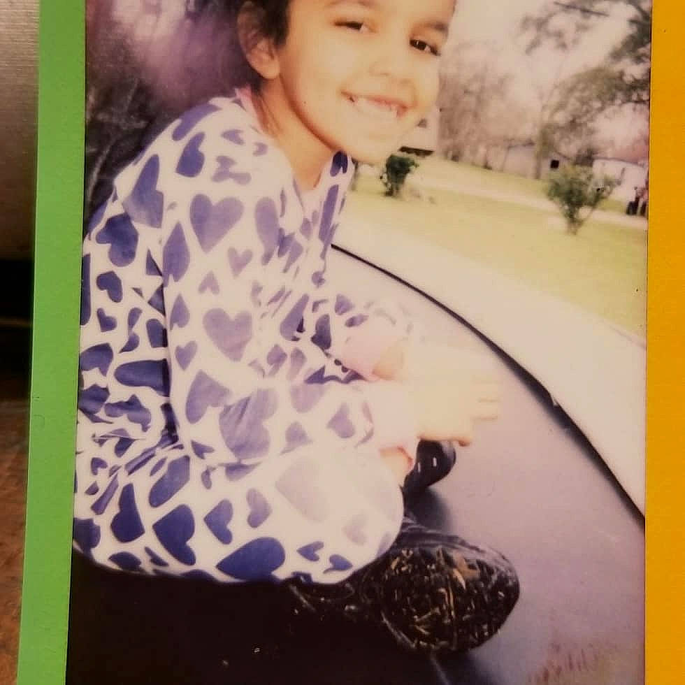 Lena is registered to the contest to win money with this photo: child, day, design, girl, joy, material, neck, outerwear, pattern, person, product, square, textile, toddler