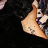 black_cat, blanket, cat, closeup, cozy, cuddle, ear, fur, hand, human_arm, indoor, nap, pattern, paw, pet, sleeping_cat, sleepy, tattoo, textile, whiskers